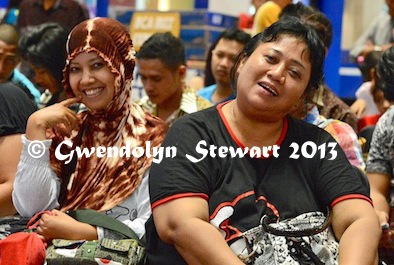 A Pair of Spectators at a Beauty Contest at the
Ambarrukmo Mall, Yogyakarta, Indonesia, Photographed by Gwendolyn
Stewart, c. 2014; All Rights Reserved