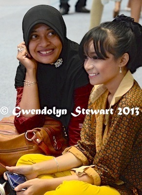 A Pair of Spectators at a Beauty Contest at the 
Ambarrukmo Mall, Yogyakarta, Indonesia, Photographed by Gwendolyn 
Stewart, c. 2014; All Rights Reserved